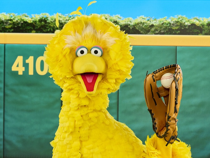 Big Bird holding a baseball mitt